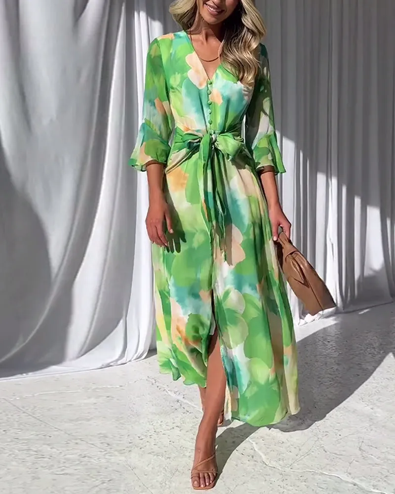 Elegant printed dress with bell sleeves and button slit